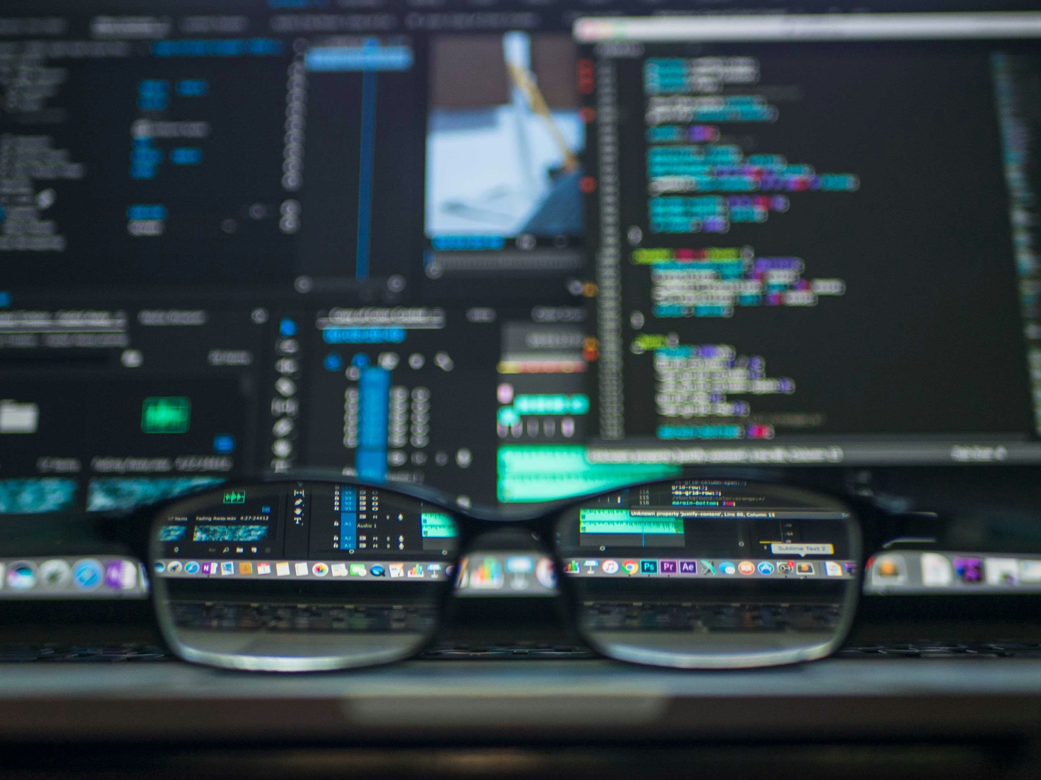 Computer screen showing programming code and database interface, symbolizing e-government data management and digital transformation.