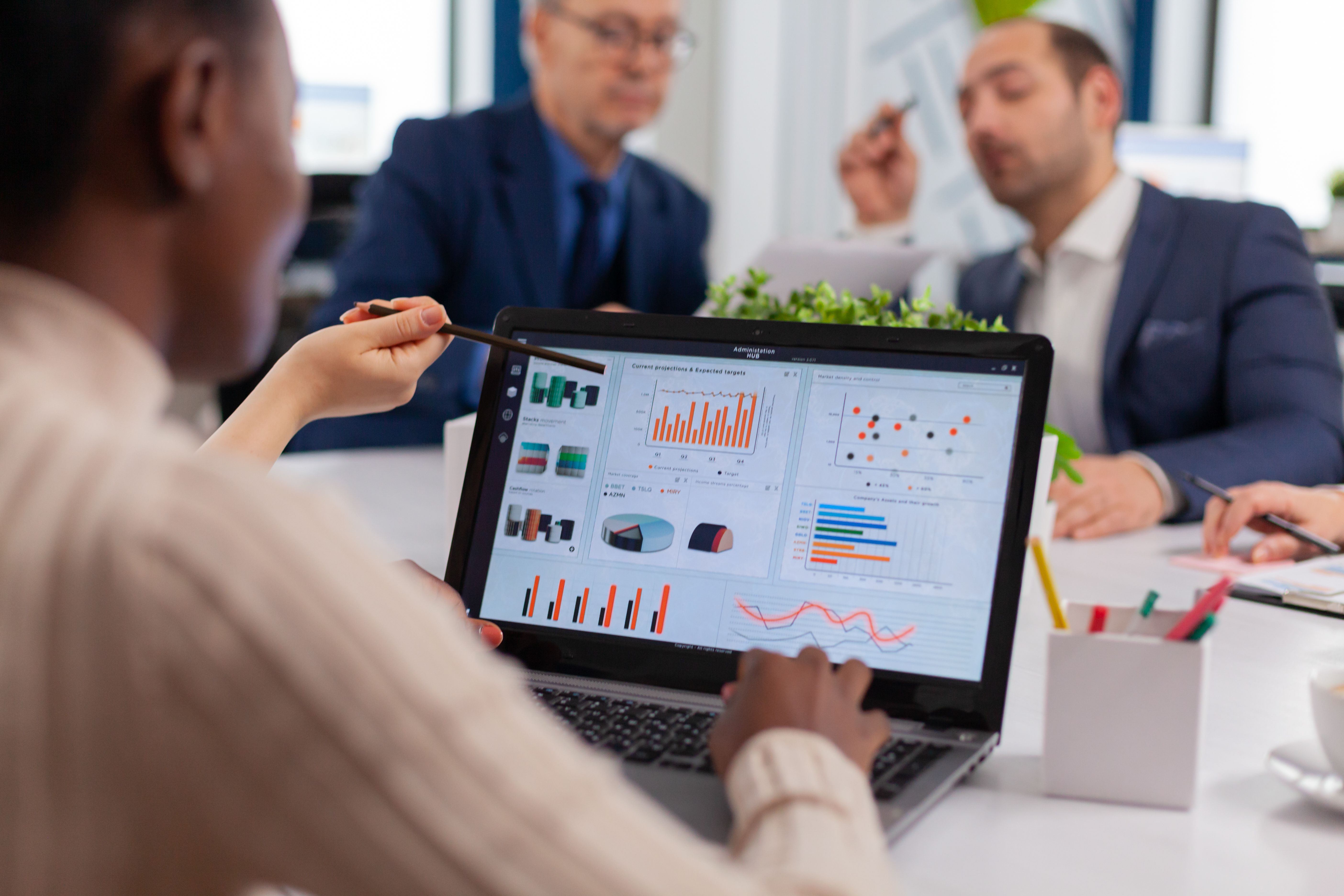 multi-ethnic-business-team-sitting-table-office-center-speaking-about-project-meeting-broadroom.jpg