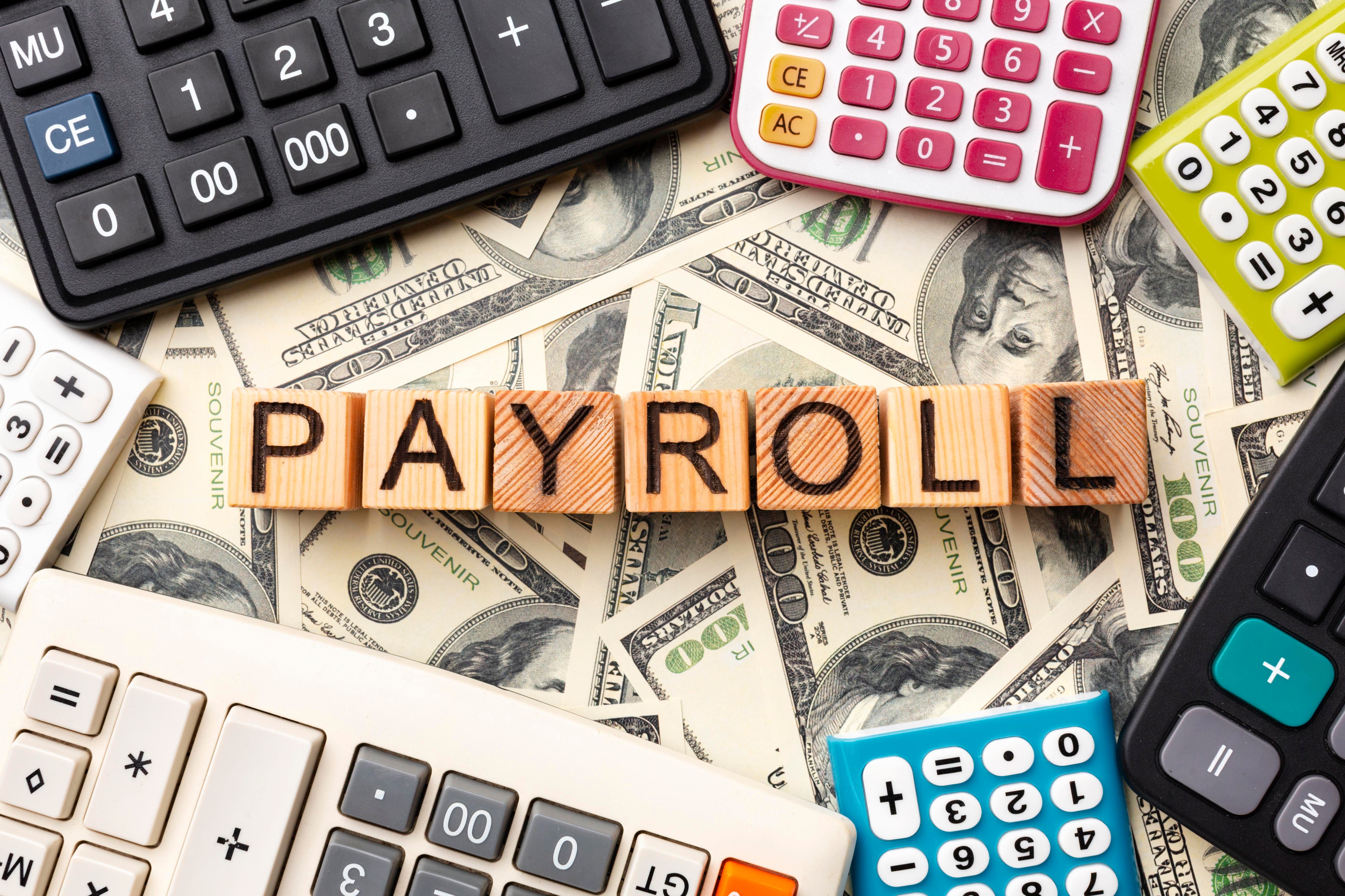 top-view-payroll-concept-with-cash.jpg